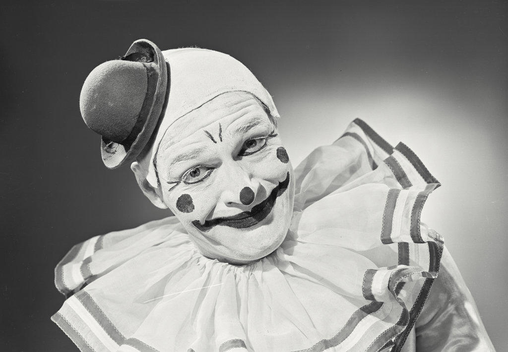 Portrait of clown wearing silly hat
