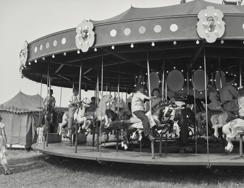 children on carousel