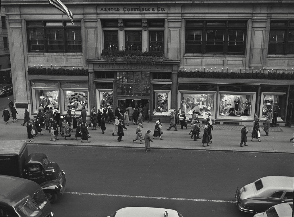 crowd walking down street in new York city
