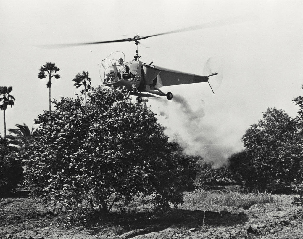 Bell helicopter performing Black fly fogging operations