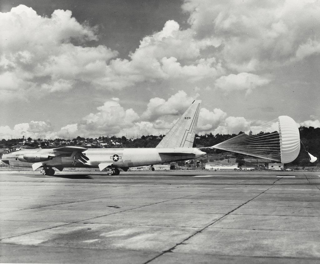 The Boeing YB-52 Stratofortress slows to a halt with the aid of its drag chute