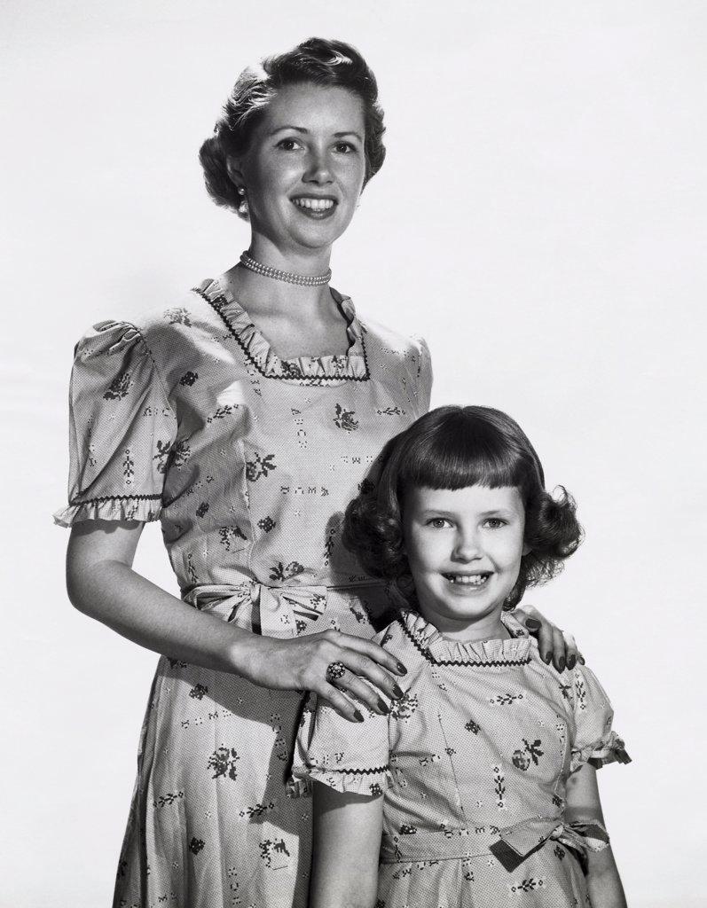 Portrait of a mother smiling with her daughter
