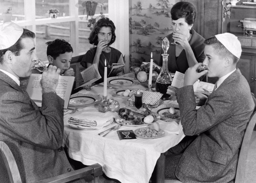 Jewish family taking Seder dinner during Passover festival