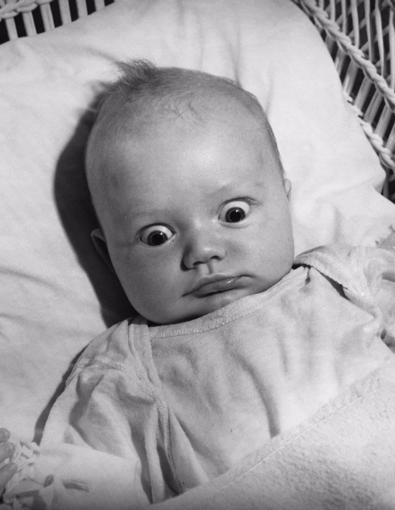 Close-up of a baby looking shocked