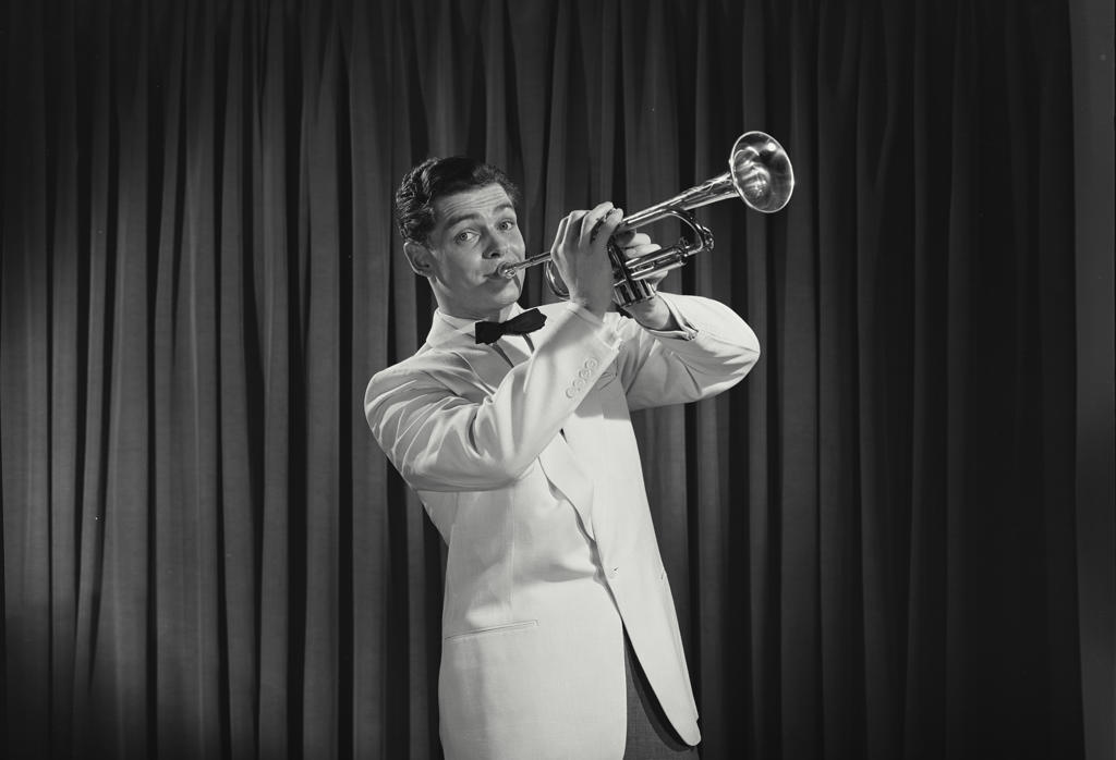 Portrait of a young man playing the trumpet