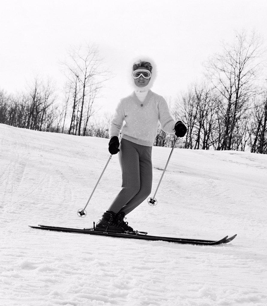 Woman in goggles skiing