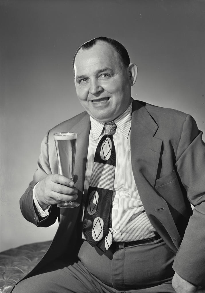 Portrait of a mature man holding a glass of beer