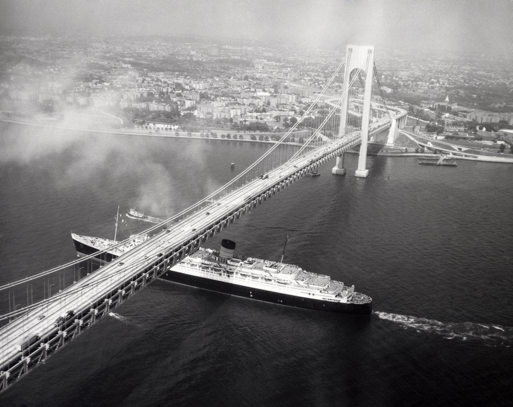 USA, New York State, New York City, High angle view of cruise ship passing under Verrazano-Narrows Bridge