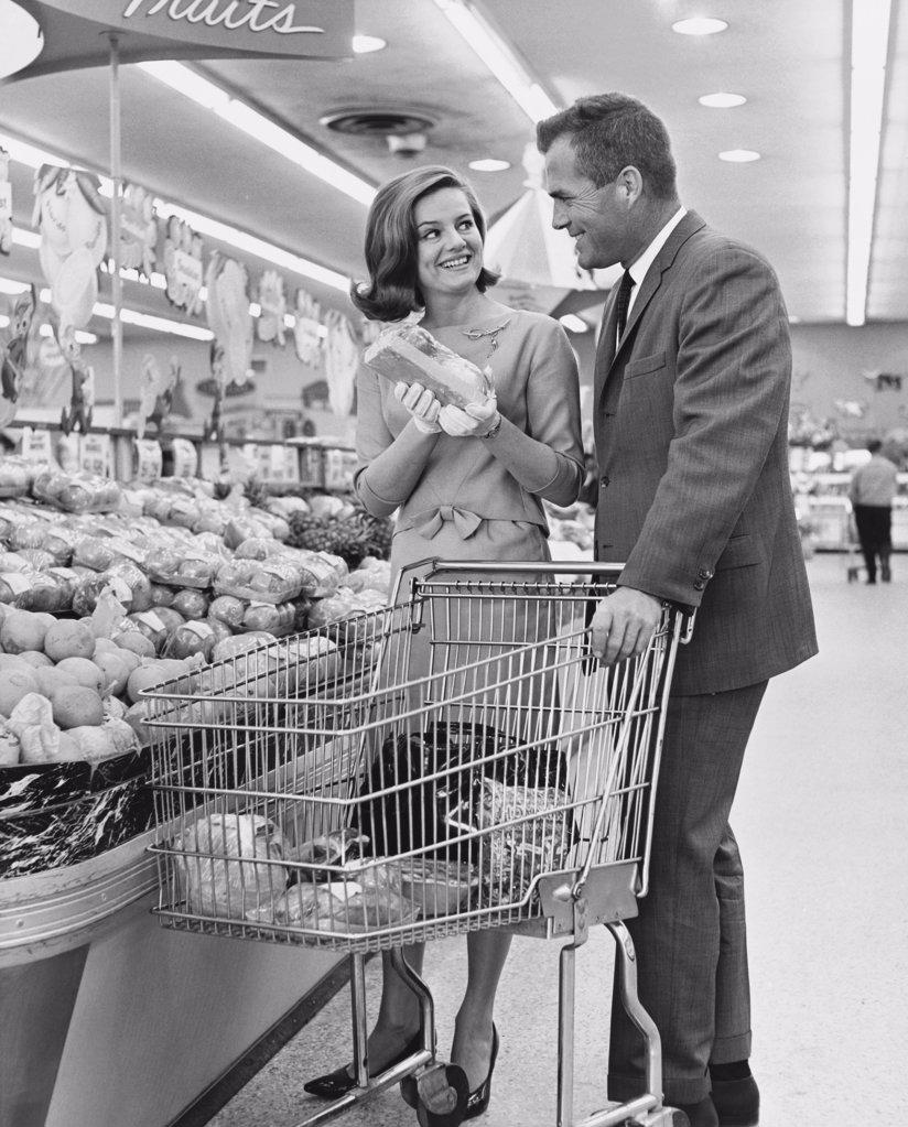 Mid adult couple shopping in a supermarket