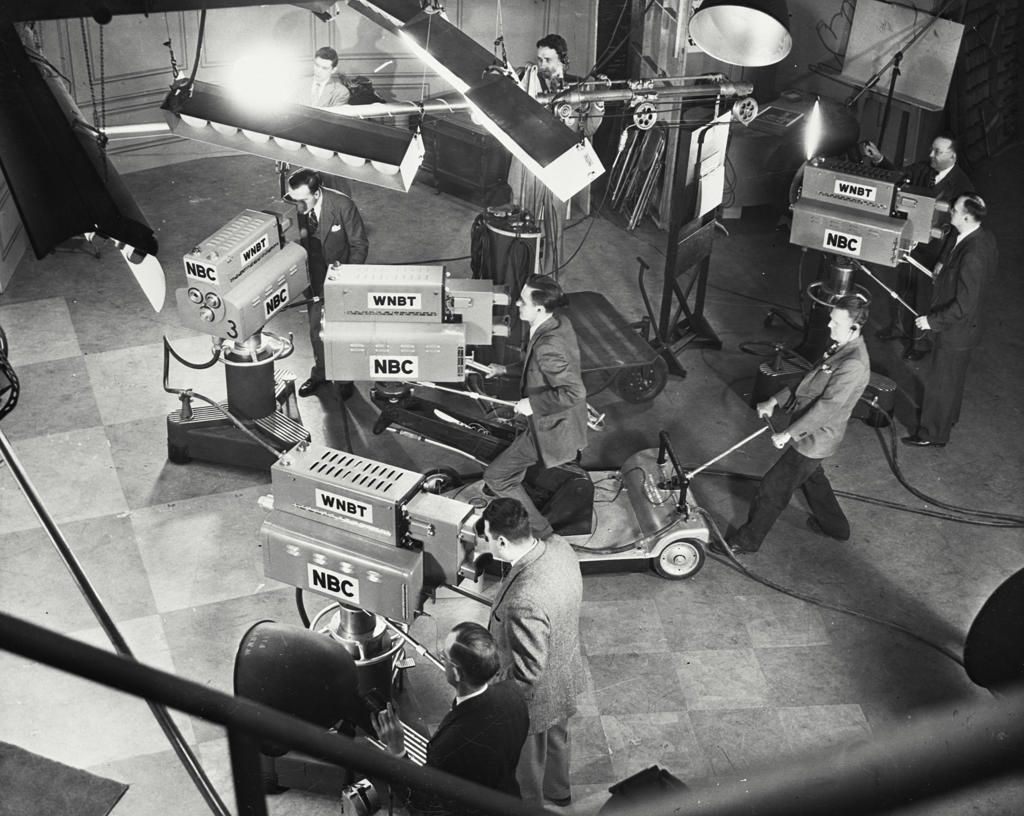 High angle view of four camera operators in a television studio