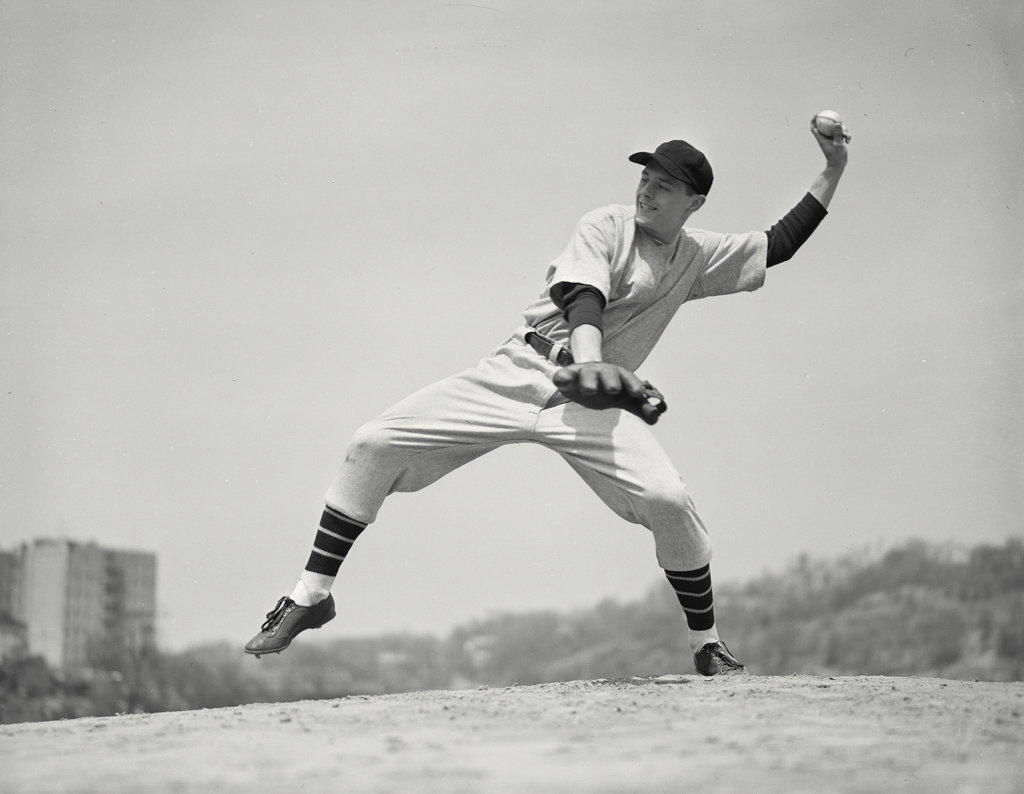 Side view of baseball pitcher during pitch