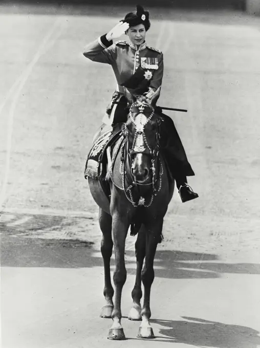 Vintage photograph. Queen Elizabeth II taking the salute at Trooping the Color ceremony. For the first time in history a reigning Queen took part in the traditional Trooping the Color ceremony