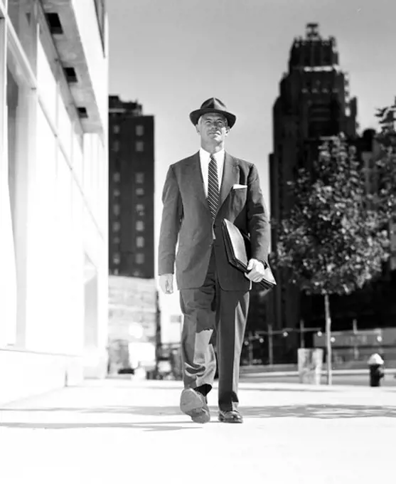 Vintage photograph of businessman walking in downtown