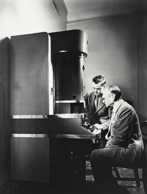 Vintage photograph. Electron microscope with its inventor Dr. VK Zworykin and Dr. James Hillier