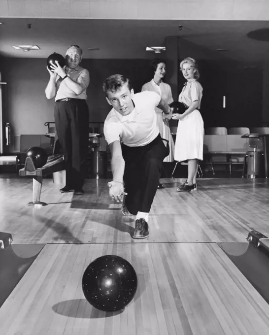 Front view of a family bowling