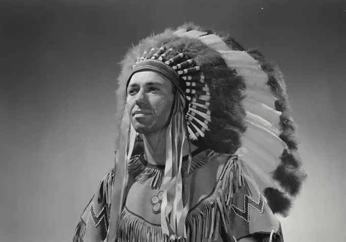 Close-up of a Native American man wearing traditional clothing