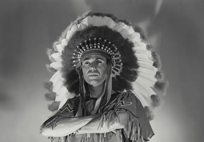 Native American man with his arms crossed
