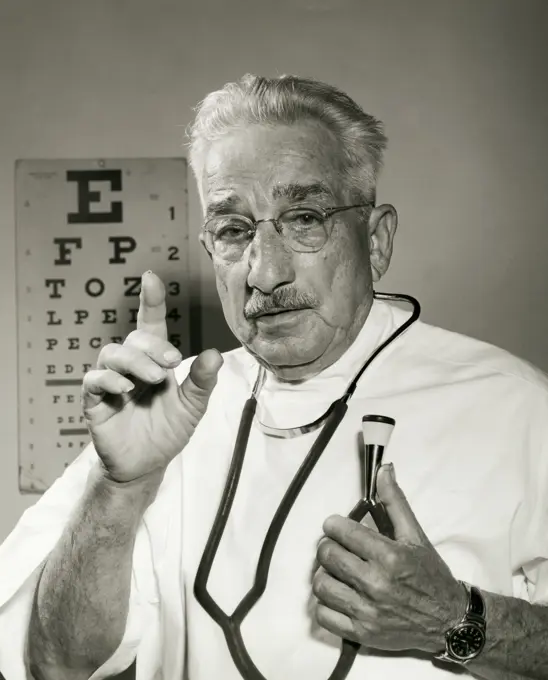 Portrait of a male doctor holding a stethoscope
