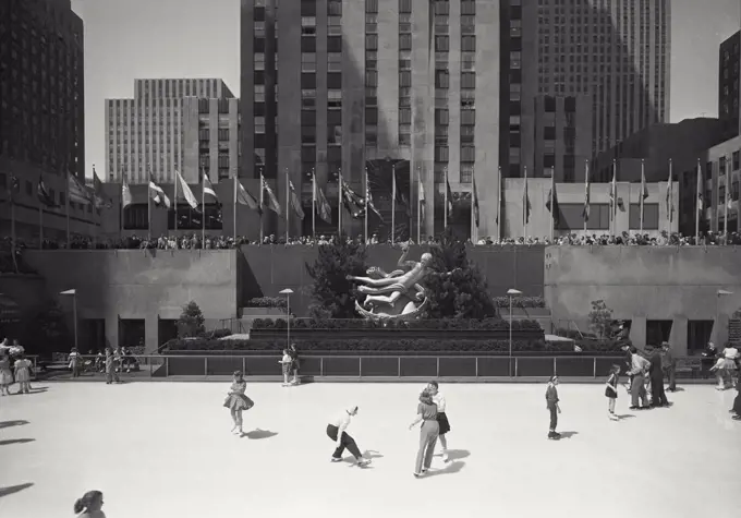 Vintage photograph. Ice rink with skaters in Rockefeller Center, New York City