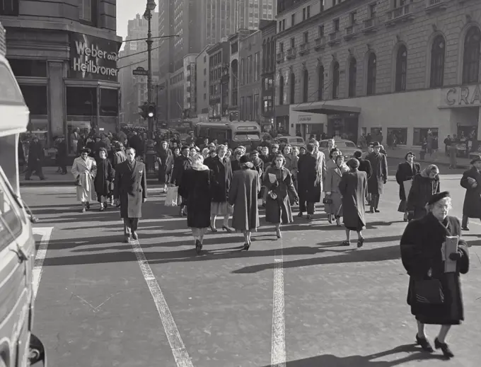 Vintage photograph. Pedestrians crossing the street near 34th Street, New York City