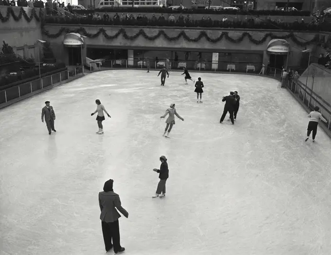 Vintage photograph. ice skating rink with skaters. Rockefeller Center