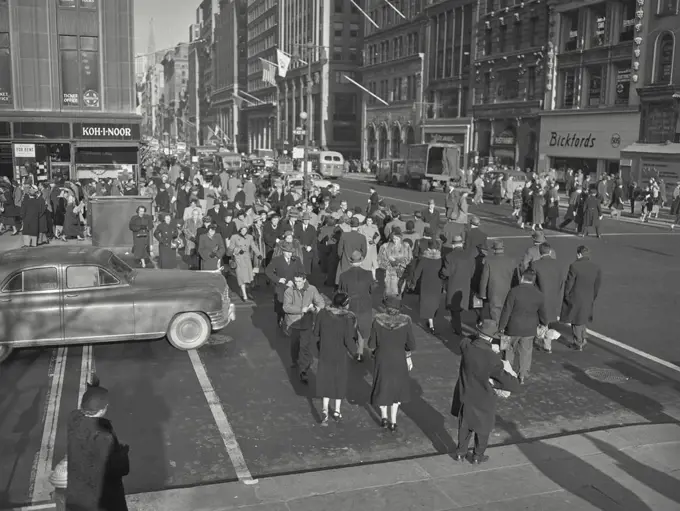 Vintage photograph. crowd walking crossing street in new York city