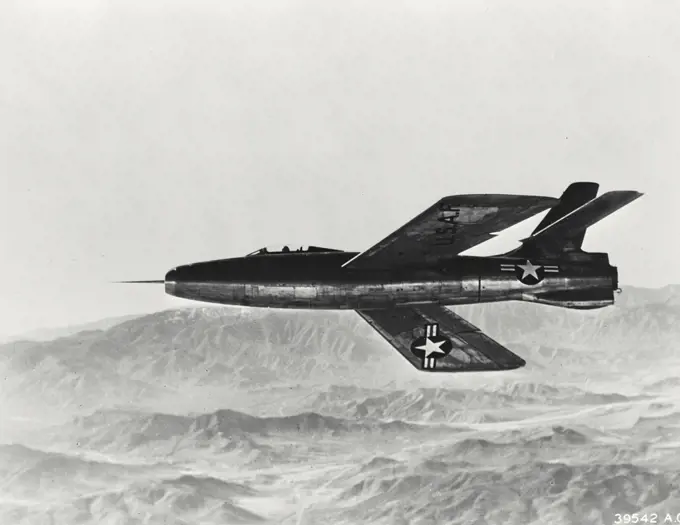 Vintage photograph. A Republic XF-91 underneath view in flight