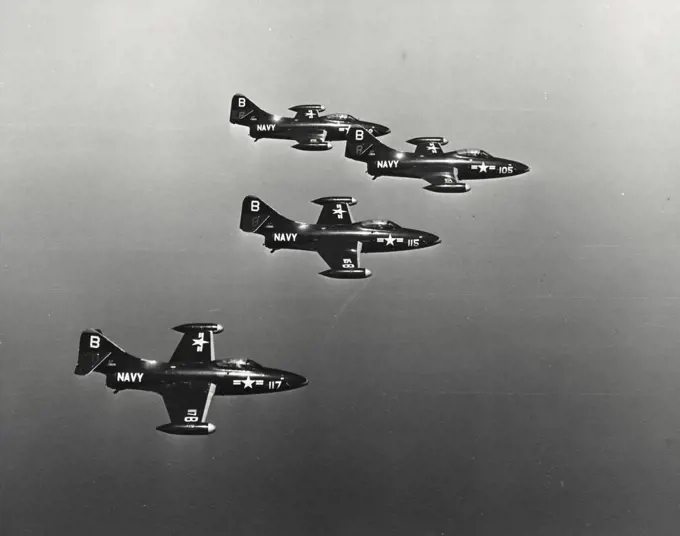 Vintage photograph. Four US Navy Panther Jets fly close formation