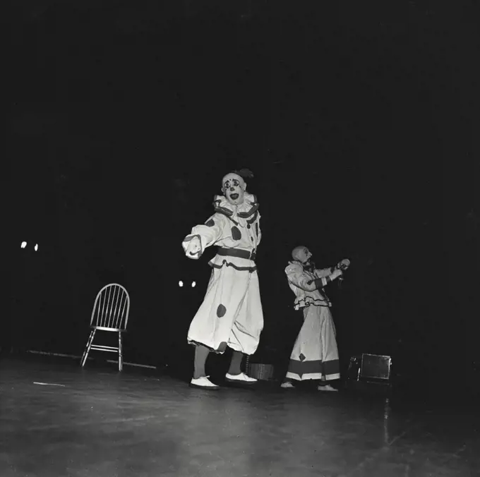 Vintage photograph. Clowns performing at circus