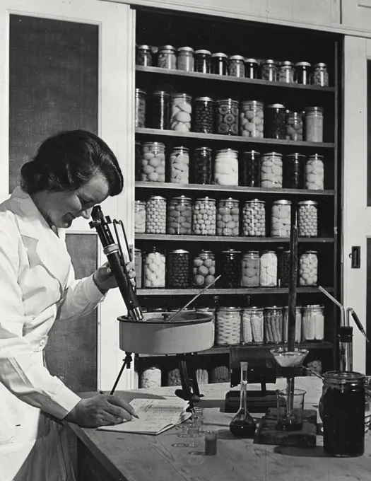 Vintage photograph. Testing the sugar contact of bottled fruit in Agricultural and Horticultural Research Station, Bristol University, England