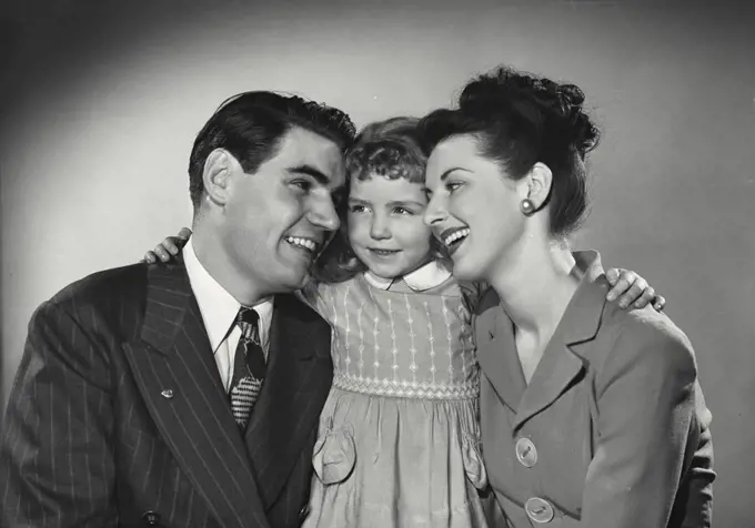 Vintage photograph. Portrait of family smiling together
