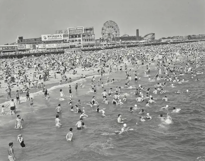 Vintage photograph. High angle view of tourists on the beach, Coney Island, Brooklyn, New York City, USA