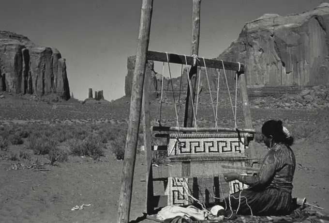 Vintage Photograph. Navajo Indian Woman weaving in Arizona.