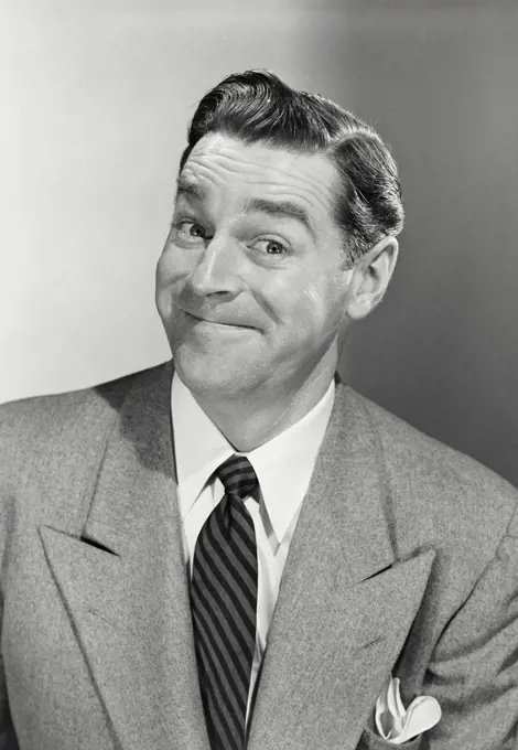 Vintage photograph. Portrait of businessman with funny smile