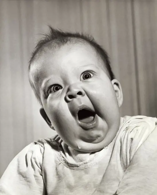 Close-up of a baby yawning