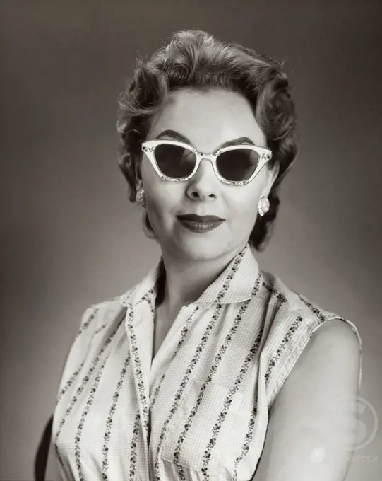 Close-up of a young woman wearing sunglasses