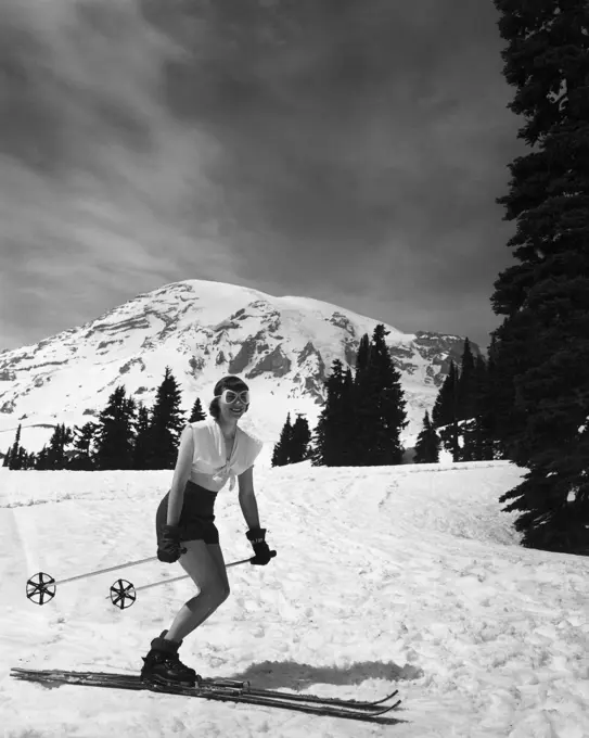 Woman skiing on snow, Mt Rainier National Park, Washington State, USA