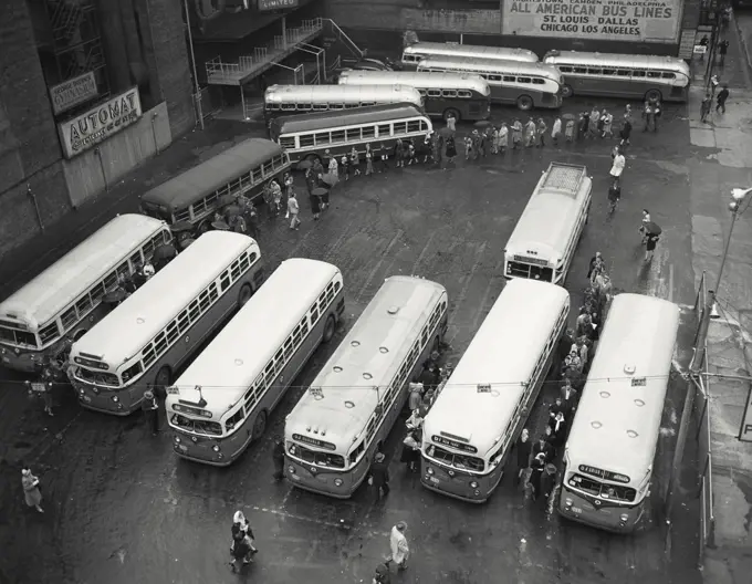 Vintage photograph. High angle view of buses parked in a bus station, New York City, New York, USA