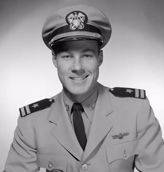 Studio portrait of male pilot smiling