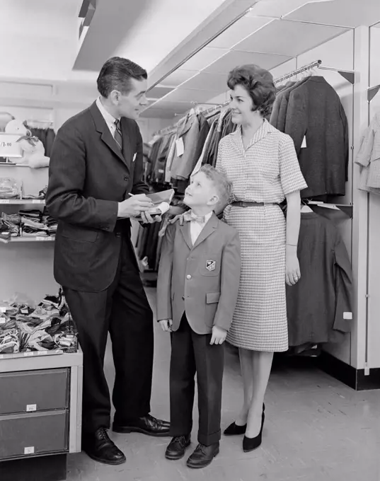 Parents with son in clothes shop