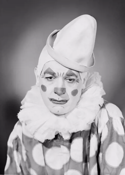 Studio portrait of sad clown