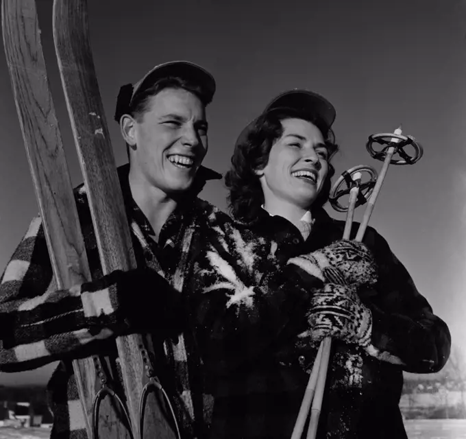 Portrait of young couple on ski holiday