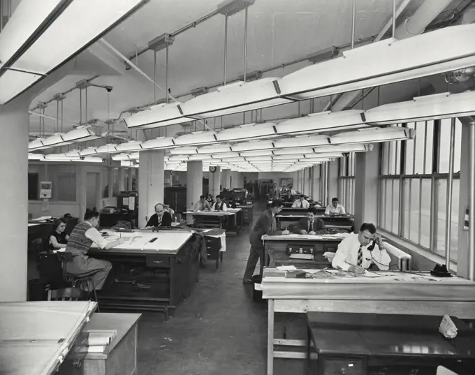 Vintage photograph. Applied mechanics personnel at work at armor research foundation of Illinois Institute of technology