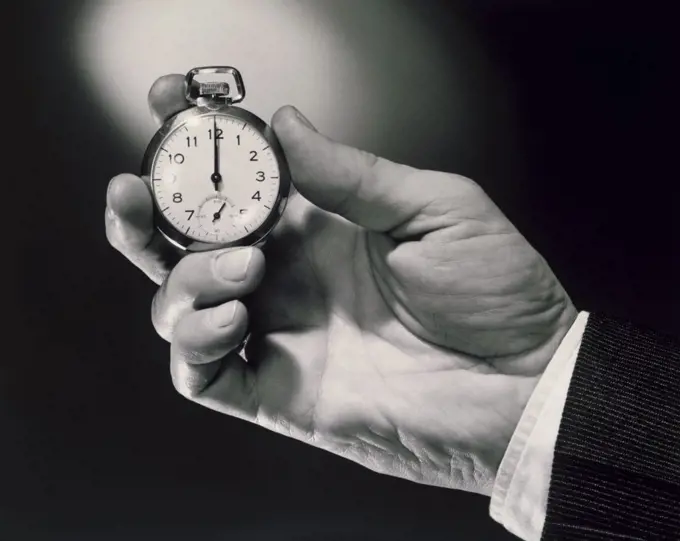 Close-up of man's hand holding a watch