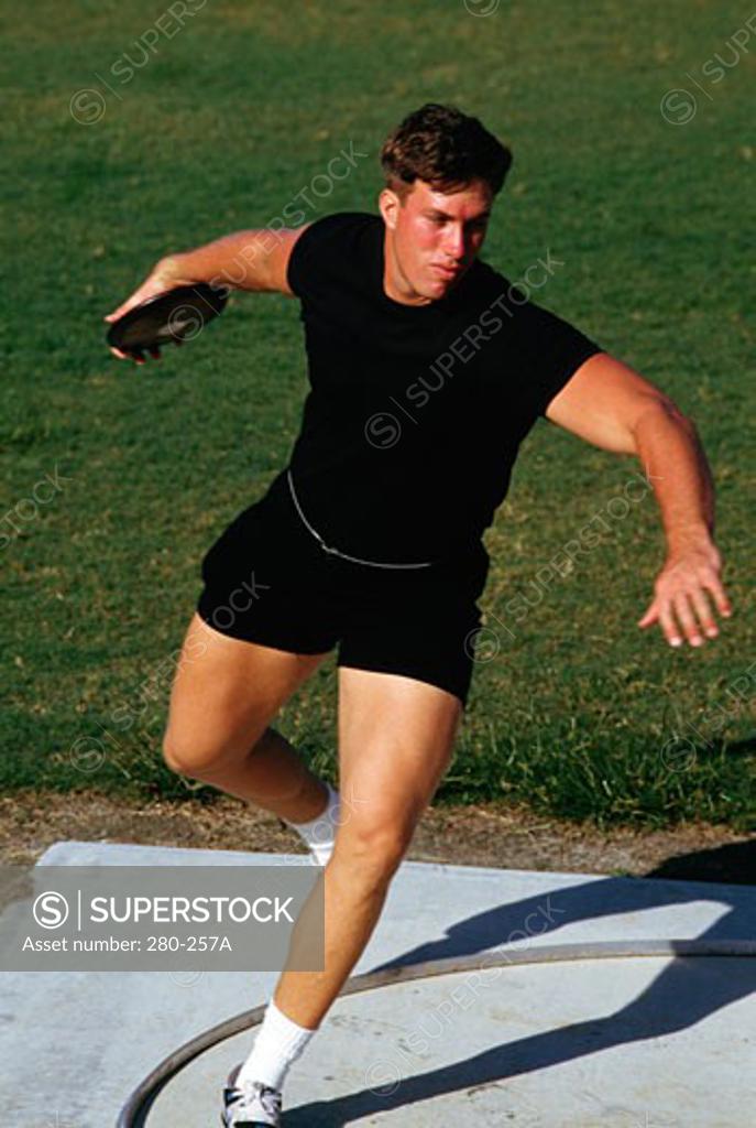 Stock Photo: 280-257A Young man preparing to throw a discus