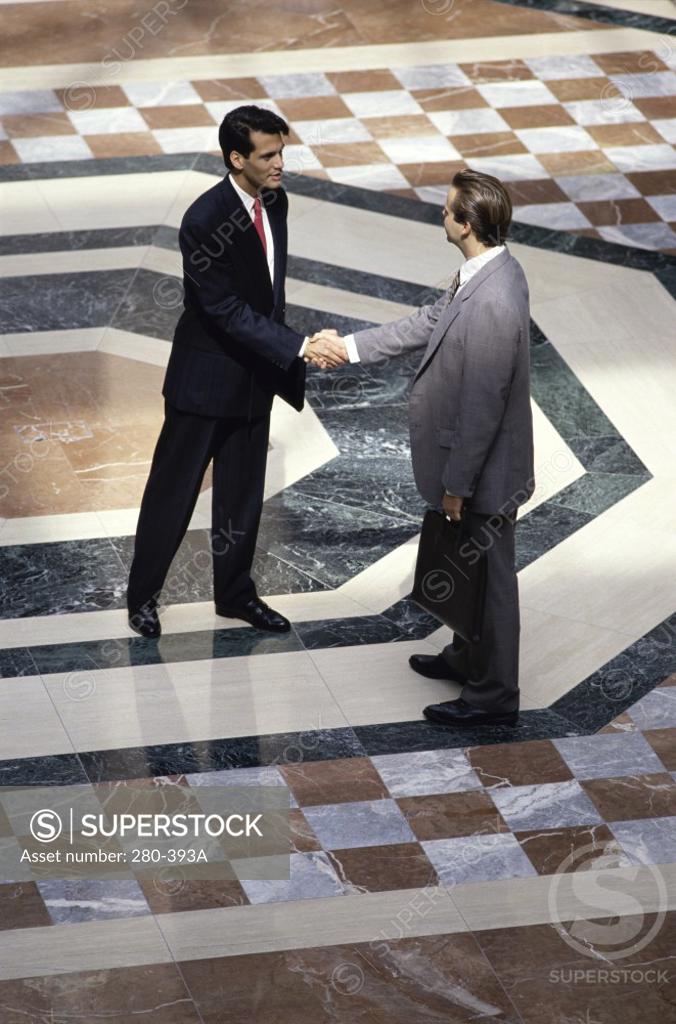Stock Photo: 280-393A Two businessmen shaking hands