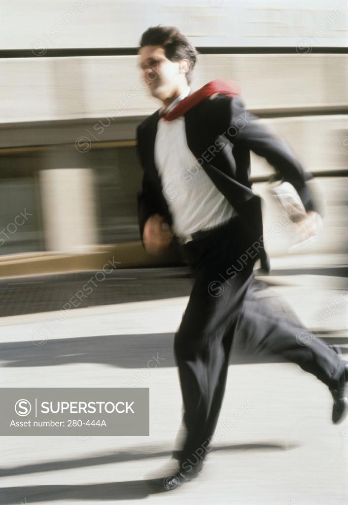 Stock Photo: 280-444A Side profile of a businessman running