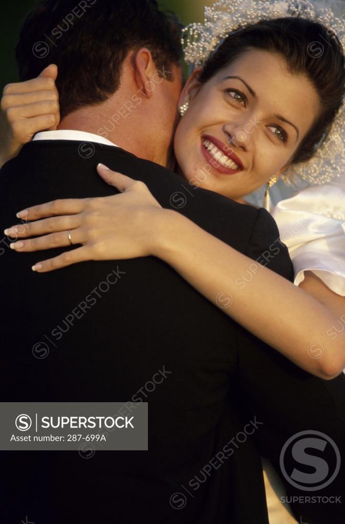 Stock Photo: 287-699A Newlywed couple embracing each other