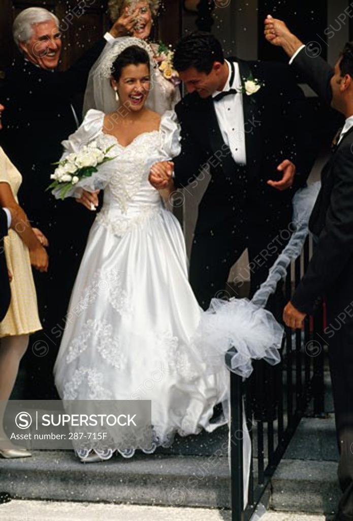 Stock Photo: 287-715F Bride and groom smiling with holding hands