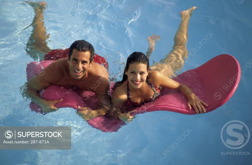 Stock Photo: 287-871A High angle view of a young couple swimming in a swimming pool